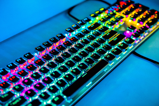 Modern computer keyboard for gamers with neon light. Colorful concept.