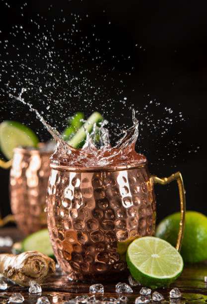 istock Famous splashing Moscow mule alcoholic cocktail in copper mugs. 1163496102