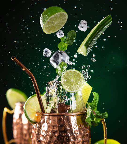 istock Famous splashing Moscow mule alcoholic cocktail in copper mugs. 1163496112
