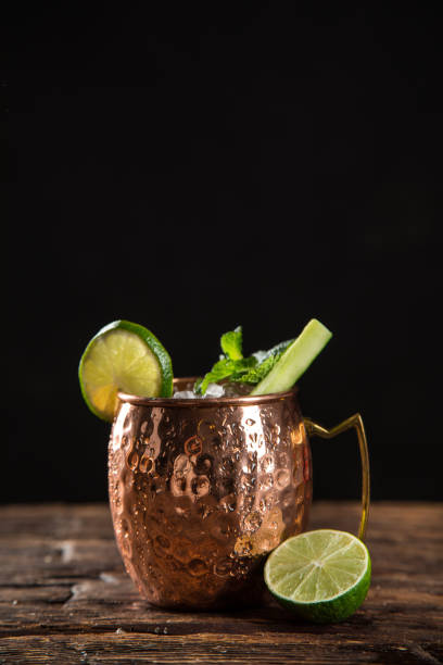 istock Famous splashing Moscow mule alcoholic cocktail in copper mugs. 1163496136