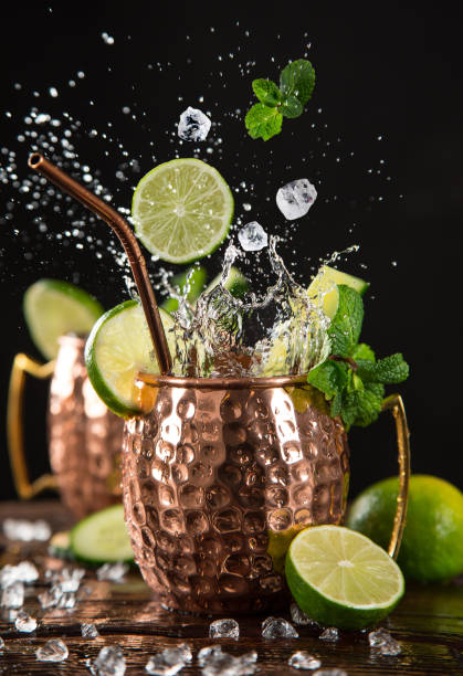 istock Famous splashing Moscow mule alcoholic cocktail in copper mugs. 1163496148