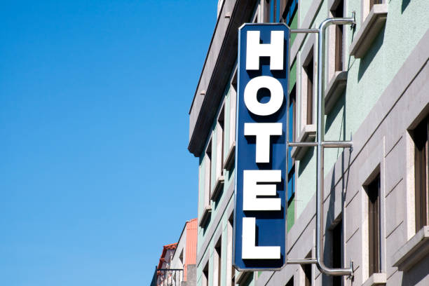 Hotel sign and facade, clear sky, sunny weather.. stock photo