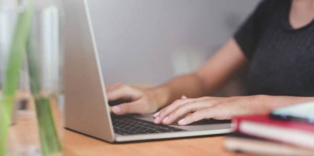 istock Female's hands typing on laptop 1163497706