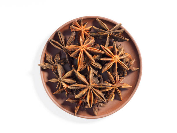 istock Anise (Anisum vulgare) on a brown clay plate on a white background 1163497935
