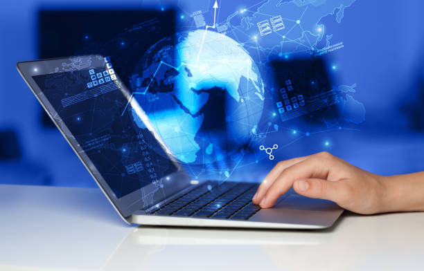 istock Hand using laptop with worldwide reports links and statistics concept 1163498134