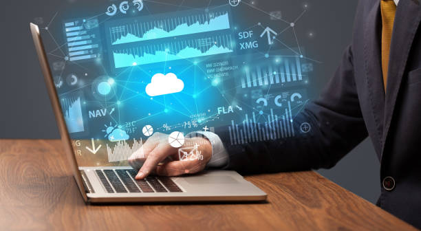 istock Hand typing on laptop graphs and charts and reports concept around 1163498804