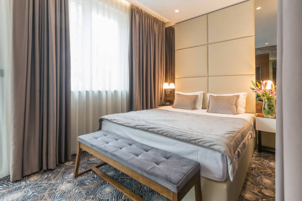 istock Interior of a luxury hotel double bed bedroom 1163498969