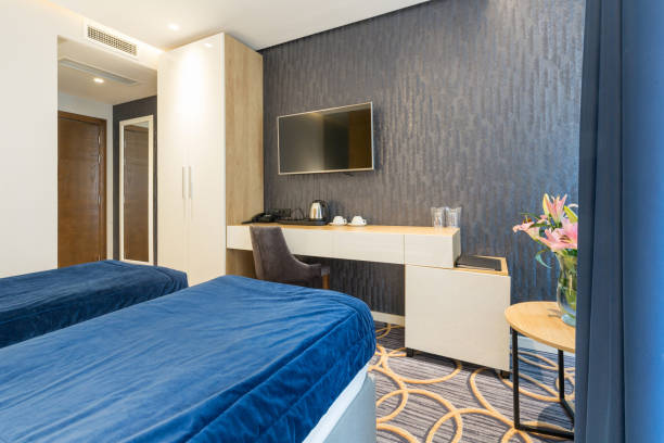 istock Interior of a modern luxury hotel double bed bedroom 1163499024