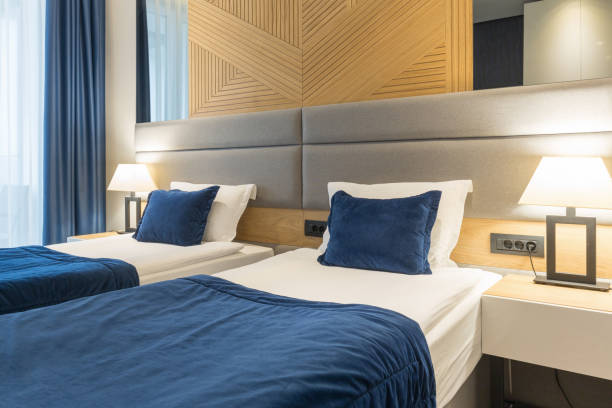 istock Interior of a modern luxury hotel double bed bedroom 1163499136
