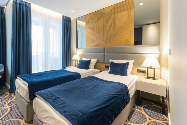 istock Interior of a modern luxury hotel double bed bedroom 1163499217
