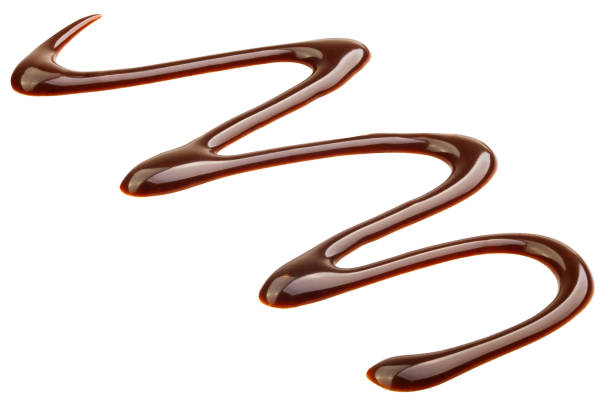 istock Liquid chocolate syrup isolated on white background, clipping path, full depth of field 1163499594