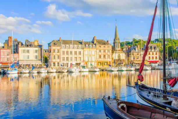 Scene of Vieux Port (Old Harbor), houses and boats in Honfleur, France Honfleur is located in Calvados, Normandy. It is famous for its old port