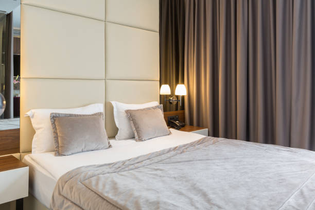 istock Interior of a luxury hotel double bed bedroom 1163500446