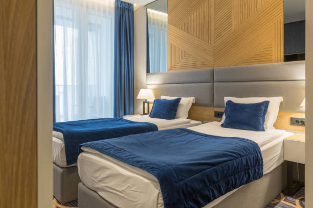 istock Interior of a modern luxury hotel double bed bedroom 1163500484