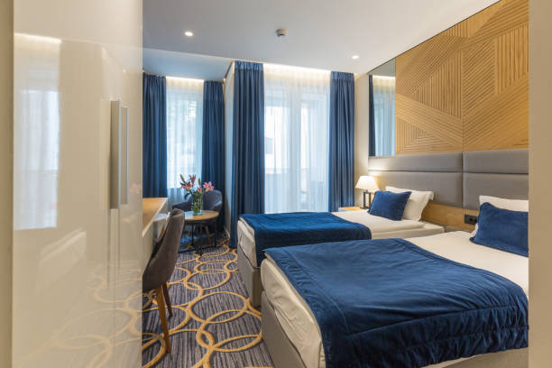 istock Interior of a modern luxury hotel double bed bedroom 1163500534