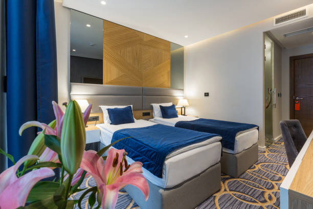 istock Interior of a modern luxury hotel double bed bedroom 1163500698