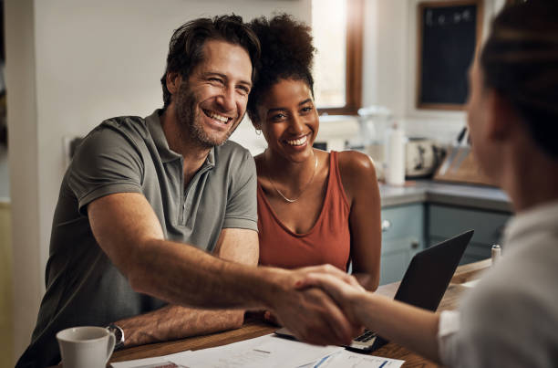 Thank you so much for your assistance Cropped shot of a handsome middle aged man shaking hands with a financial advisor during a consultation at home casual handshake stock pictures, royalty-free photos & images