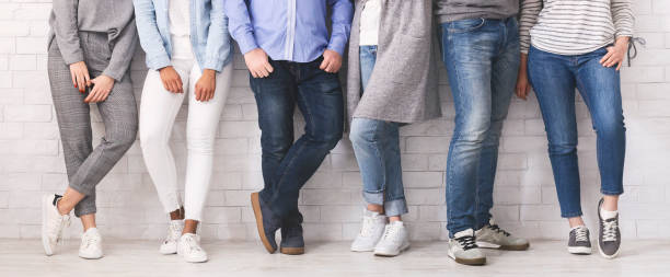 istock Legs of diverse people standing in row 1163502193