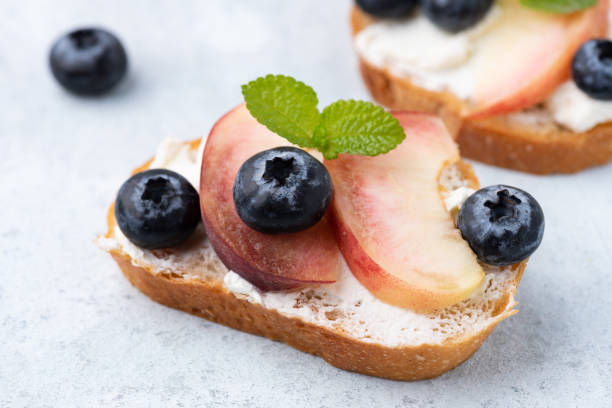 istock bread toast with peach and blue berry 1163503875