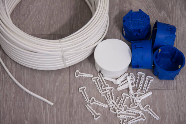 istock Equipment for connecting the power supply system on a wooden background. 1163504105