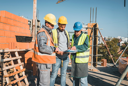Construction Worker Introduction Experienced Construction Worker Is Explaining Building Project To His ...