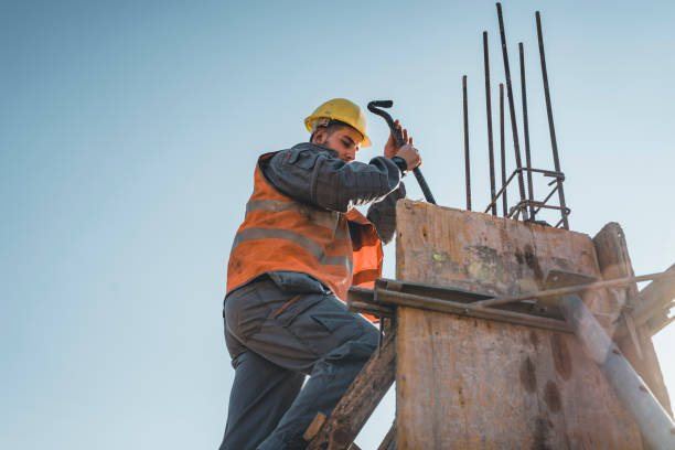 istock Building Worker is Working at the Rooftop at the Construction Site 1163504783