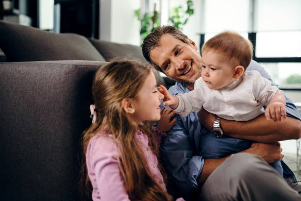 istock Happy father spending time with his children at home. 1163507669