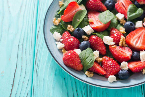 istock Summer Strawberry salad with spinach , cheese , nuts and blueberry 1163507685