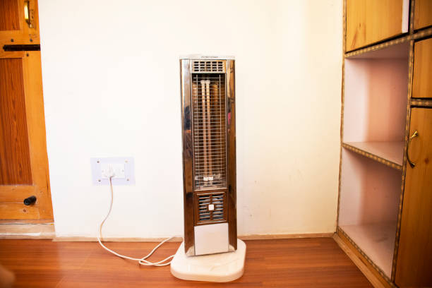 Classic retro electric heater of Indian and tibetan people in living room of house stock photo