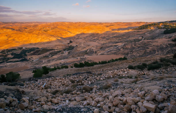 istock Dramatic orange sunset in mountains in Jordan 1163509055