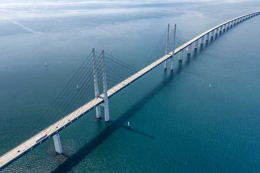 Aerial of the famous Øresund Bridge. The longest combined road and rail bridge in Europe that connects the two major metropolitan areas Copenhagen, the Danish capital city, and the Swedish city of Malmö. Converted from RAW.