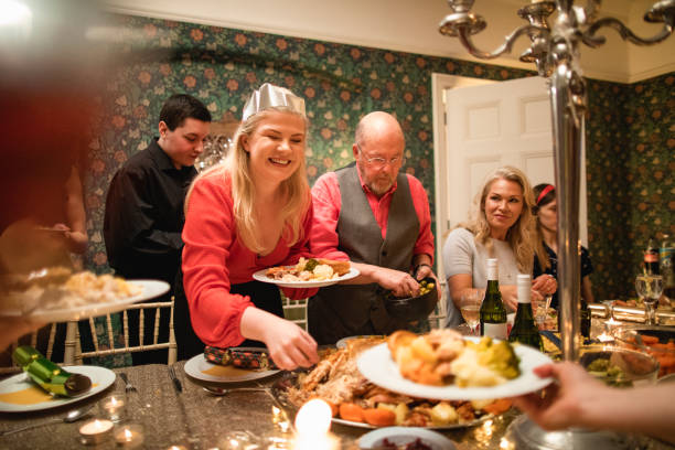 istock Friends Enjoying Christmas Dinner 1163509408