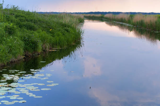 storm sky over the river, artificial pond channel