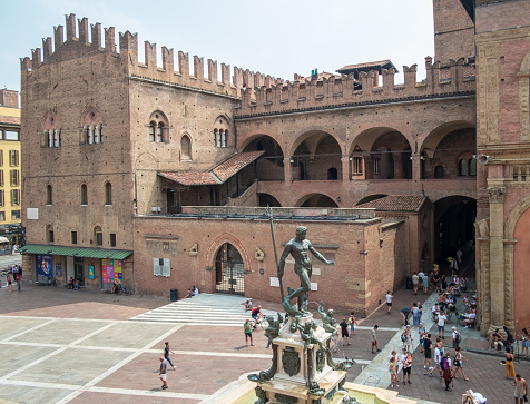 06-28-2019. Bologna, Italy, famous Palazzo Re Enzo (King Enzo Palace) and Neptune Statue at Piazza del Nettuno (Neptune Square). Bologna, Emilia Romagna, Italy.