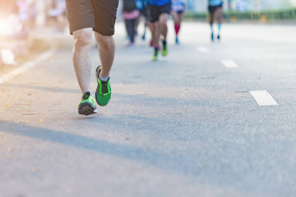 istock Men, women, run the marathon. 1163517014