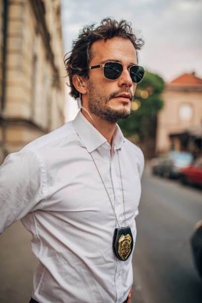 istock Handsome gentleman detective on the street 1163517479