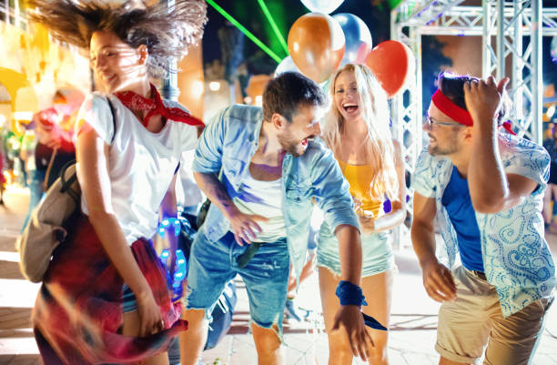 istock Group of youngsters at a concert. 1163519403