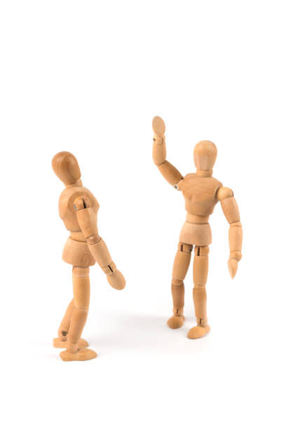 istock waving wooden mannequin 1163520423