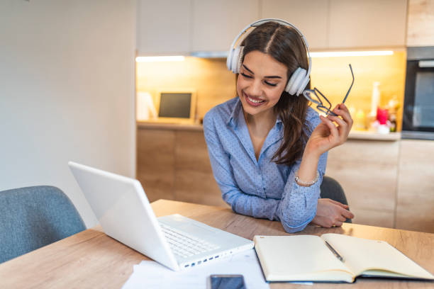 istock Woman watching video lecture on line sitting at home. 1163520675