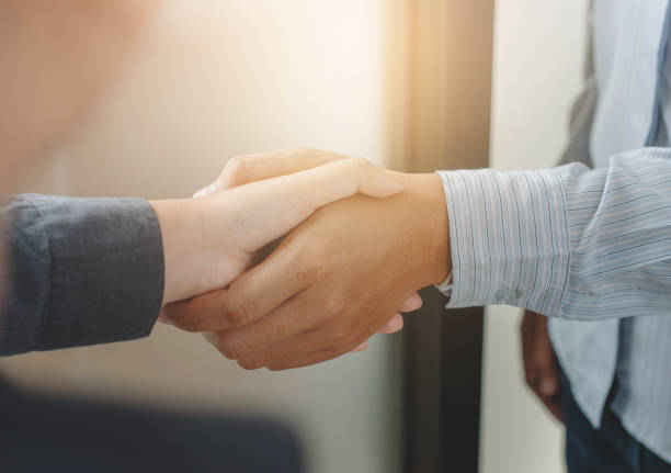 istock Business partnership meeting handshake in office room. 1163522581