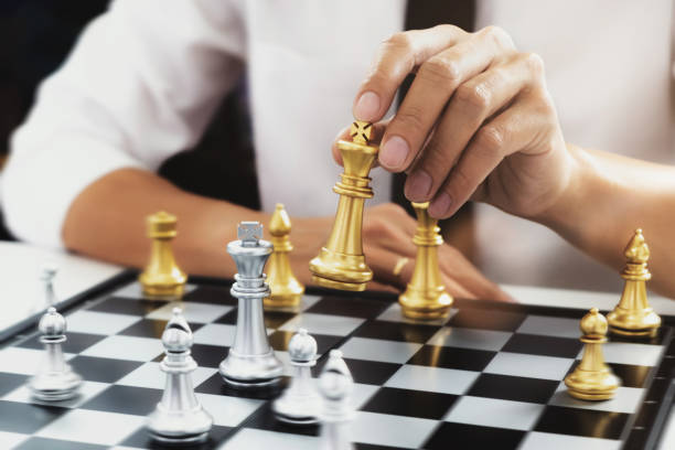 istock Businessman competition in chess board game. 1163522687