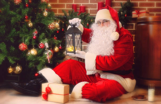 istock Santa Claus with Christmas tree 1163523515