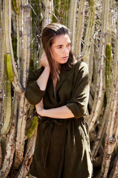 istock Brunette by cactus in desert 1163524906