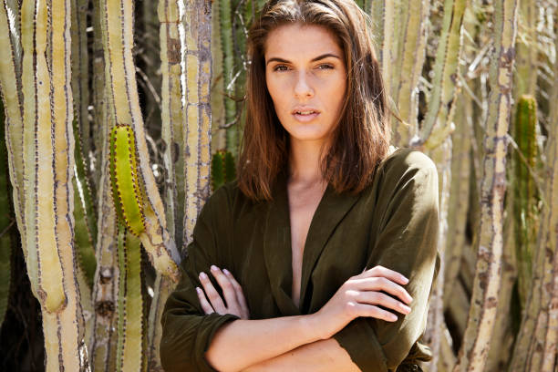 istock Brunette beauty with arms folded 1163524943