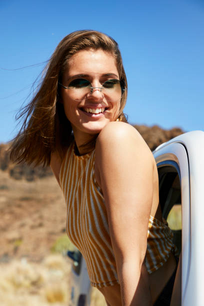 istock Smiling brunette in car 1163526269