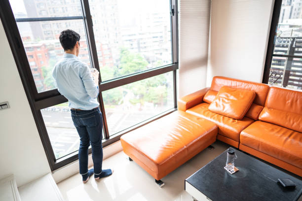 istock Enjoying first coffee and stunning view from his apartment 1163526346