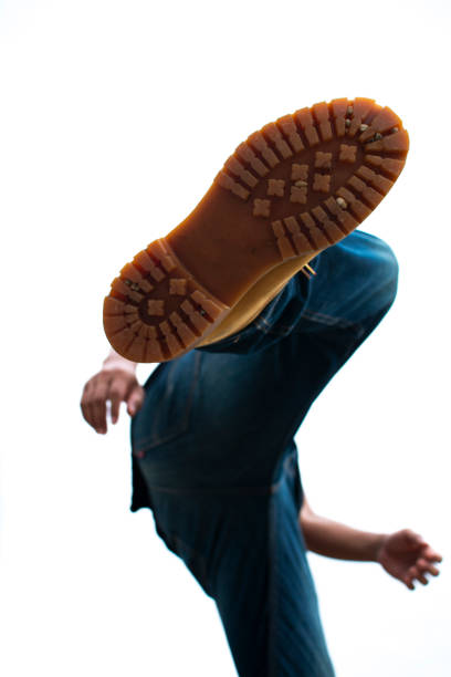istock Under view of man dancing on white background 1163526529