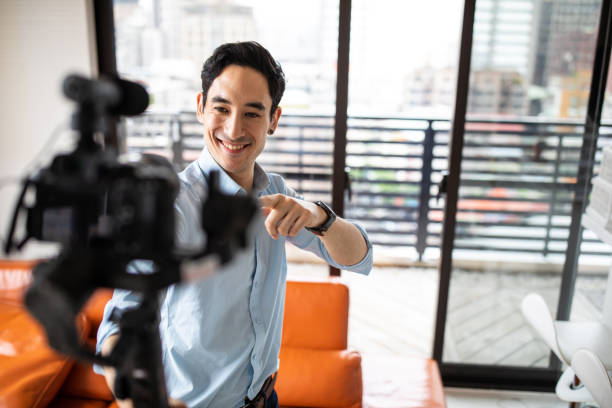 istock Cheerful blogger recording video in apartment 1163526706