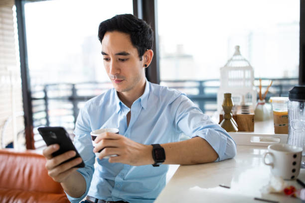istock Hearing impaired man surfing the net on cellphone 1163526830