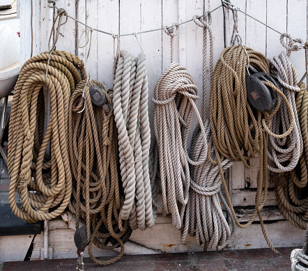 Skeins of rope strung along a wire on an old boat moored at Nyhavn, the old harbour in Copenhagen, capital of Denmark.